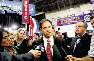  ?? THE PALM BEACH POST 2012 ?? U.S. Sen. Marco Rubio, R-Fla., talks to the media in the spin room at Lynn University in Boca Raton after the October 2012 debate between President Barack Obama and Mitt Romney. Rubio’s win of his Senate seat two years earlier catapulted him into...