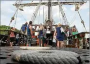  ??  ?? Anderson Rohdewald, 4, holds onto his mother, Elizabeth Rohdewald of Brooklyn, as they wait to descend into the lower cabin of the Spanish El Galeón Andalucía that is docked a the Hudson River Maritime Museum in Kingston, N.Y., until Tuesday.