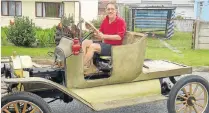  ??  ?? PASSION PROJECT: Philip Kuschke’s 1915 Model T Ford during its restoratio­n phase. Here he is testing the chassis for the first time