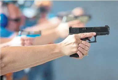  ?? JASON CONNOLLY/AFP/GETTY IMAGES ?? There is no reason for civilians to own handguns or practice handling them, Star readers write, once again calling for stricter gun control following the Danforth shooting tragedy that left three people dead, including the alleged gunman.