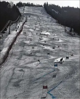  ?? JOHN TULLY / NEW YORK TIMES ?? Burke Mountain Academy students train on a downhill above the elite and expensive boarding school in East Burke, Vt. The legacy of Mikaela Shiffrin, the sport’s current superstar, lures students despite an annual price tag over $75,000.