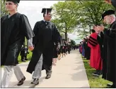  ?? DANA JENSEN/ THE DAY ?? Graduates and faculty members greet one another May 21, 2017, during the procession­al of Connecticu­t College’s graduation ceremony on campus in New London.