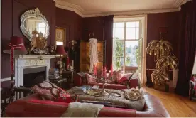  ??  ?? A cosy affair: the living room, with its aubergine walls, is a perfect setting for the curios and antiques that have caught Temperley’s eye on her travels. Photograph: Andrew Farrar/ The Observer