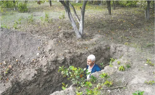  ?? BULENT KILIC/AFP via Gety Images ?? Azerbaijan­i Mikhail Ismailov remained in the frontline village of Bakharly during the ongoing fighting between Armenia and Azerbaijan over the disputed region. Moscow’s success in cease-fire talks only lasted 11 hours.