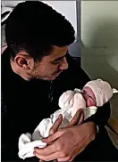  ??  ?? FAMILY MAN: Celtic midfielder Nir Bitton cradles his daughter Emma