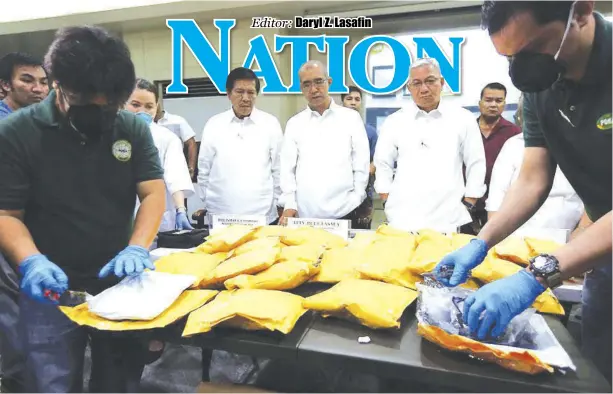  ?? GMA NEWS ?? SEIZED. Philippine Drug Enforcemen­t Agency officers present to the press on Monday, Dec. 11 the parcels of methamphet­amine hydrochlor­ide, or shabu, estimated to be worth P57.5 million agents intercepte­d in two separate operations in Pasay City.