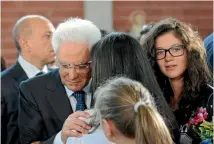  ?? PHOTO: REUTERS ?? Italian President Sergio Mattarella comforts a woman after a funeral service for victims of the earthquake inside a gym in Ascoli Piceno.
