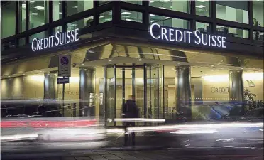  ??  ?? Aiming big: Credit Suisse logo is seen at the group’s headquarte­rs in Milan, Italy. The Swiss bank is betting that it can attract wealthy customers by offering individual clients loans in the hundreds of millions of dollars as it pivots from investment...