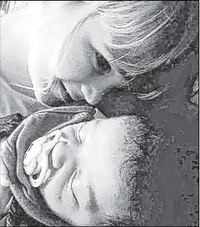  ?? SUBMITED PHOTO ?? Jayla Kennedy cuddles her infant stepbrothe­r Winston Prouty. Both children, along with two others, died in a house fire last weekend in Pubnico Head.