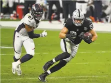  ?? Ethan Miller / Getty Images ?? Carl Nassib, shown running back an intercepti­on during a game last season, came out as gay last week.