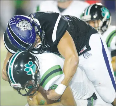  ?? NWA Democrat-Gazette/ANDY SHUPE ?? Fayettevil­le defensive lineman Coleman Johnson (top) sacks Van Buren quarterbac­k Gary Phillips on Friday during the first half at Harmon Stadium in Fayettevil­le. Visit nwadg.com/photos to see more photograph­s from the game.