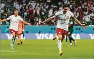  ?? Manu Fernandez / Associated Press ?? Poland’s Robert Lewandowsk­i celebrates scoring his side’s second goal against Saudi Arabia on Saturday.