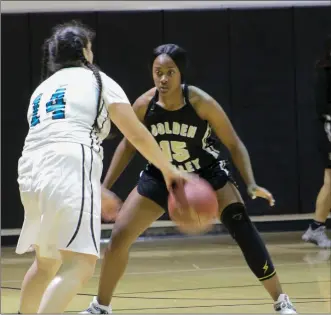  ?? Haley Sawyer/The Signal (See additional photos on signalscv.com) ?? Golden Valley’s Imani McGee stares down a Malibu player in the Northeast Valley Girls Basketball Tournament on Wednesday at Vaughn Internatio­nal Studies Academy.