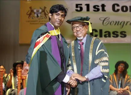  ?? Keno George) (Photo by ?? Aarif Baksh from the Faculty of Natural Sciences after receiving the Chancellor’s Medal for the second best graduating Bachelor’s Degree Student from Chancellor Nigel Harris.