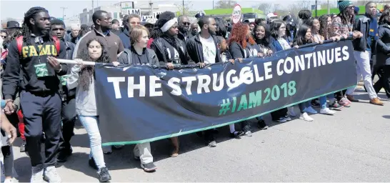  ?? Pictures / AP ?? Marchers in Memphis marking the 50th anniversar­y of the assassinat­ion of Martin Luther King this week vowed to continue his struggle.