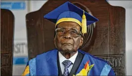  ?? BEN CURTIS / ASSOCIATED PRESS ?? Zimbabwe President Robert Mugabe sits for formal photograph­s after presiding over a graduation ceremony Friday at Zimbabwe Open University in Harare. The authority of the world’s oldest head of state is evaporatin­g daily.