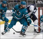  ?? NHAT V. MEYER — BAY AREA NEWS GROUP, FILE ?? Sharks defenseman Marc-Edouard Vlasic, center, suffered an upper-body injury during practice Friday and missed Saturday's game against the Predators at SAP Center.