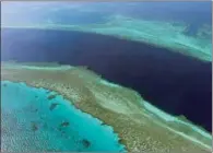  ?? (AFP) ?? An aerial view of the Great Barrier Reef off the coast of the Whitsunday Islands, along the central coast of Queensland. (File photo)