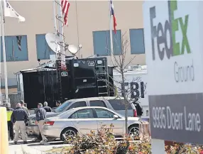  ??  ?? FBI, ATF and local police investigat­e an explosion at a FedEx facility in Schertz, Texas, on Tuesday. A package exploded while being transporte­d on a conveyor causing minor injuries to one person. SCOTT OLSON/GETTY IMAGES
