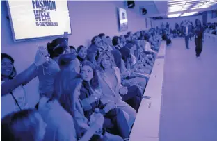  ?? HENRY NICHOLLS/REUTERS ?? Members of the public attend the Alexa Chung public catwalk show during London Fashion Week in London, Britain, Saturday.