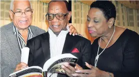  ?? CONTRIBUTE­D ?? Minister of Culture, Gender, Entertainm­ent and Sport Olivia Grange listens as Paul Buchanan reads a section of his book, ‘Jones Town Trench Town: The Journey Back’. The book was launched on March 29 at the Mona Visitors’ Lodge, University of the West...