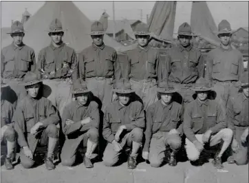  ?? PHOTO COURTESY OF DR. LAWRENCE D. HAWKINSON ?? A detail of a large panoramic framed photograph of the 158th Field Hospital Company, 115th Sanitary Train at the home of Dr. Lawrence D. Hawkinson in Saratoga on October 4. His father Lawrence Hawkinson is in the photograph, bottom center, with his arm on his knee.