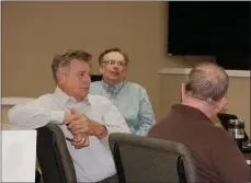  ?? Bennett Horne/The Weekly Vista ?? Bella Vista City Councilman Larry Wilms listens as staff attorney Jason Kelley (back) makes a point during Monday evening’s work session held at the district courtroom.