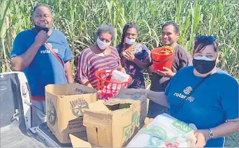  ?? Picture: SUPPLIED ?? Rotary Club of Lautoka member Teresa Ali and volunteer Moses Tagivetaua with Daulomani Safe Home residents in Lautoka.