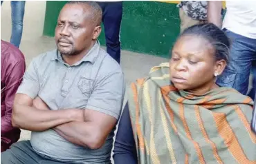  ??  ?? Joy Hagba and Julius Uche, paraded, are suspected ‘One Chance’ robbers