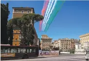  ?? Tiziana Fabi / AFP / Getty Images ?? Italian Air Force jets create the colors of the national flag to mark Liberation Day in Rome.