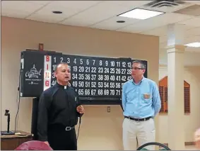  ?? L.A. PARKER - THE TRENTONIAN ?? St. Joachim’s Church Father Cesar Rubiano addressed participan­ts in the Spring Gift Bingo that benefited the Sunshine Foundation. Gino Melone served as emcee on Saturday, March 28.