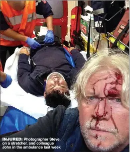  ??  ?? INJURED: Photograph­er Steve, on a stretcher, and colleague John in the ambulance last week