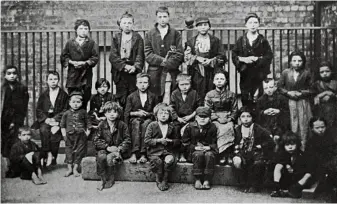  ??  ?? Guests at a Christmas dinner for the poor, held in Liverpool from 1873 on, for up to 5,000 children