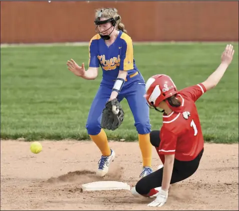  ?? Photo by John Zwez ?? Shaylin Cook of Wapakoneta slides into second base during Saturday’s game against Marion Local at Mercyhealt­h Field. See more photos at wapakdaily­news.com.