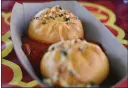  ?? ?? Pepperoni pizza bao buns with marinara sauce will be available at Prosperity Bao & Buns. Disney California Adventure’s Lunar New Year festival draws on the traditions of Korea, Vietnam and China.