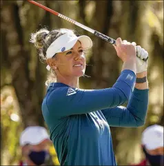  ?? ERIC GAY/ ASSOCIATED PRESS ?? Amy Olson watches her shot off the third tee during the first round of the U. S. Women’s Open on Thursday in Houston. She shot a 4- under 67 to take a one- stroke lead into today’s second round, with a total of 10 golfers within two strokes of the lead.