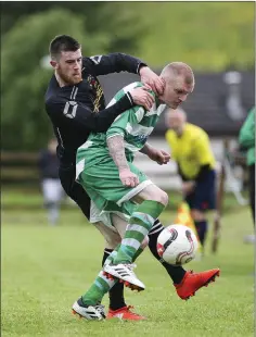  ??  ?? Avonmore’s Cian O’hÁnnáin and Arklow Celtic’s Darragh Moorehouse compete for the ball.