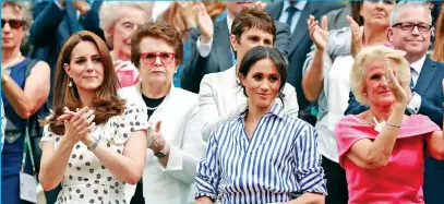  ??  ?? British Royalty Kate Middleton and Meghan Markle at Wimbledon.