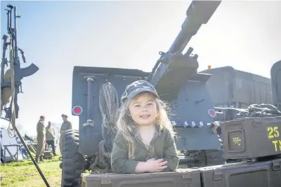  ?? Young visitor Jodie got stuck in to some military training at the 2016 show ??