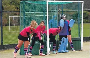  ?? 01_B46EKilbri­de07 ?? Concentrat­ion etched on their faces, Arran players prepare for an attack on goal.