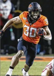  ?? SUE OGROCKI / AP ?? Oklahoma State running back Chuba Hubbard has 10 straight 100-yard rushing games.