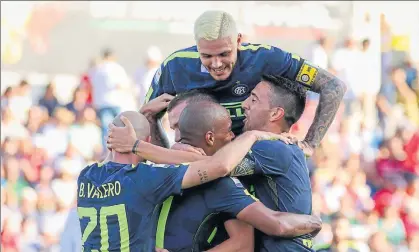  ?? AP ?? Inter Milan players, from left, Borja Valero, Ivan Perisic, Mauro Icardi, top, Joao Mario and Danilo D'Ambrosio celebrate after Ivan Perisic scored, during a Serie A soccer match between Crotone and Inter Milan at the Ezio Scida Stadium in Crotone,...