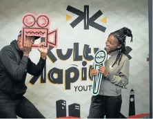  ?? Picture: LOYISO MALI ?? YOUNG AND FREE: Sanelisiwe Mdashe and Mandiphiwe Renene play around at the film screening segment of the NMB Kulture Kapital youth week at the Athenaeum on Monday
