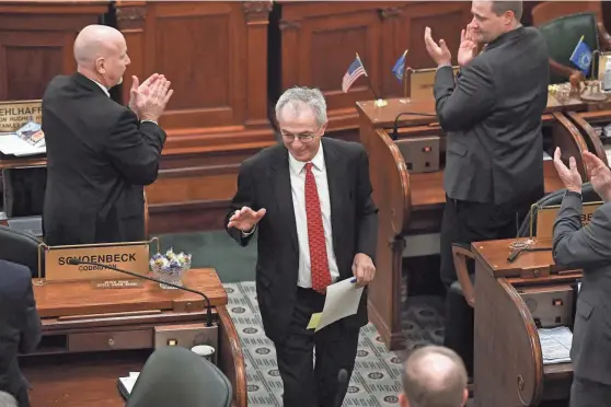  ?? PHOTOS BY ERIN WOODIEL/SIOUX FALLS ARGUS LEADER ?? South Dakota Senator Lee Schoenbeck gestures for the applause to quiet down after being sworn in as President Pro Tempore of the Senate on Jan. 10, 2023, in Pierre.