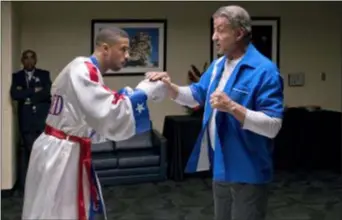  ?? BARRY WETCHER — METRO GOLDWYN MAYER PICTURES — WARNER BROS. PICTURES VIA AP, FILE ?? This image released by Metro Goldwyn Mayer Pictures / Warner Bros. Pictures shows Michael B. Jordan, left, and Sylvester Stallone in a scene from “Creed II.”