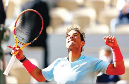  ?? AFP ?? Rafael Nadal celebrates as he breezed into his 14th Roland Garros quarter-final on Sunday.