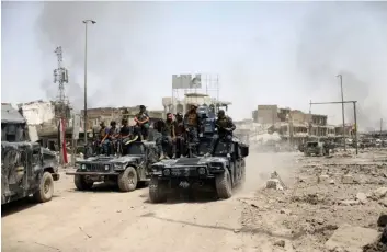  ?? AFP ?? Exército iraquiano celebra entrada triunfal em Mossul conquistad­a pela rebelião em 2014