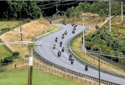  ?? PHOTO: WARWICK SMITH/FAIRFAX NZ ?? Bikes on Old West Road navigate wet conditions on the Ride For The Kids to support children with Down syndrome.