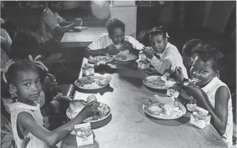  ?? SUN- TIMES PRINT COLLECTION ?? The exhibit “Black Panther Party 50 Year Retrospect­ive” highlights the group’s community service work, including a program that provided neighborho­od children with free breakfast.