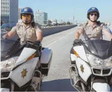  ??  ?? ROAD WARRIORS: Michael Pena and Dax Shepard, from left, play mismatched motorcycle officers.